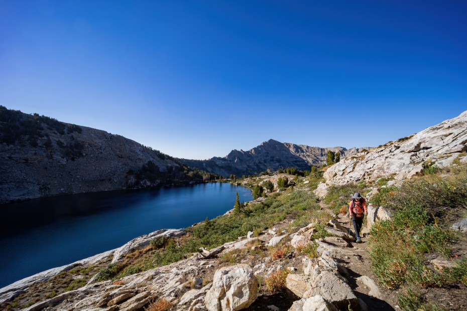 A backpacker walks by Liberty Lake in the Ruby Mountains, Nevada.