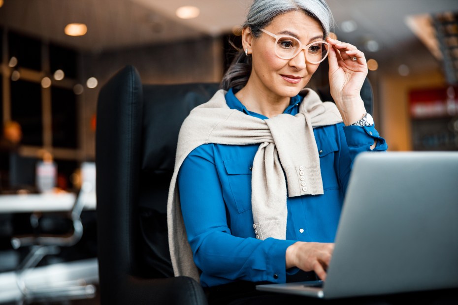 A woman backs up her computer to make recovery from malware or ransomware easier.