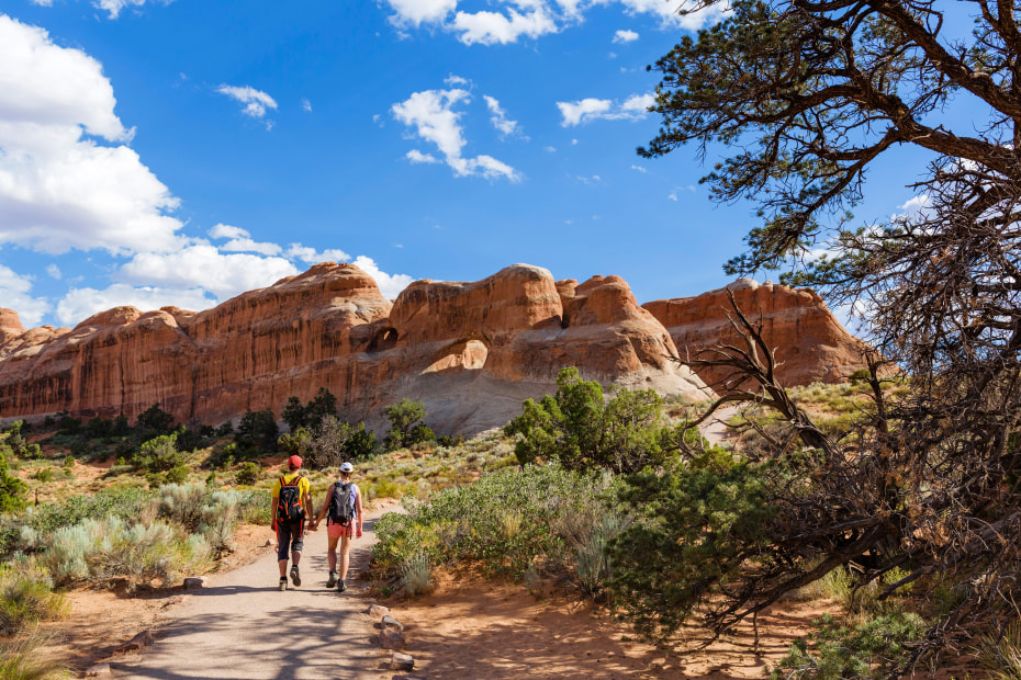 Hikers on the Devil's Garden Trail in Arches National Park.