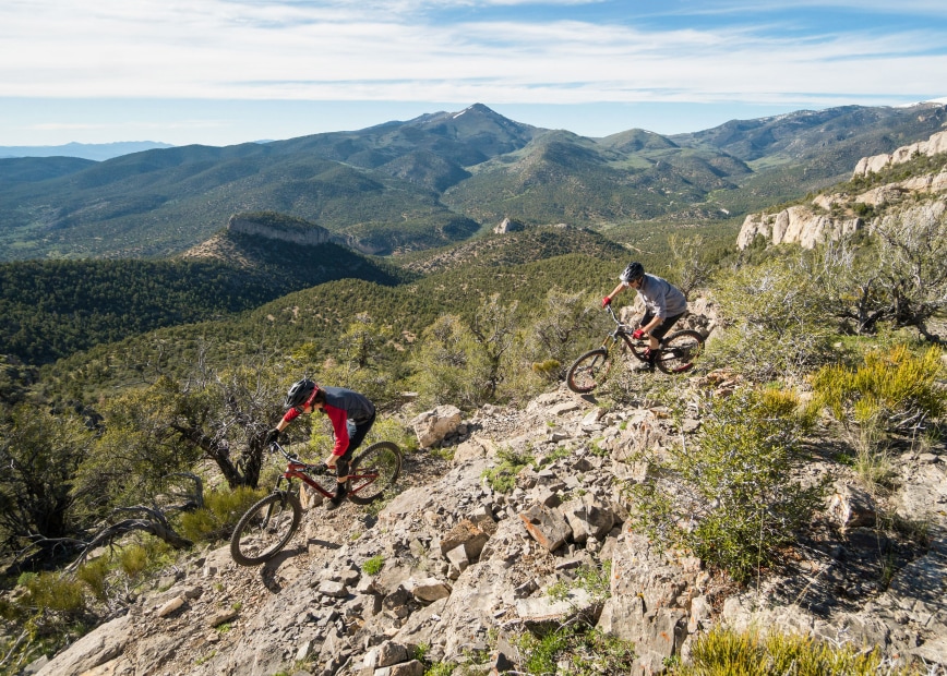 Two riders mountain biking in Cave Lake State Park in Ely, Nevada.