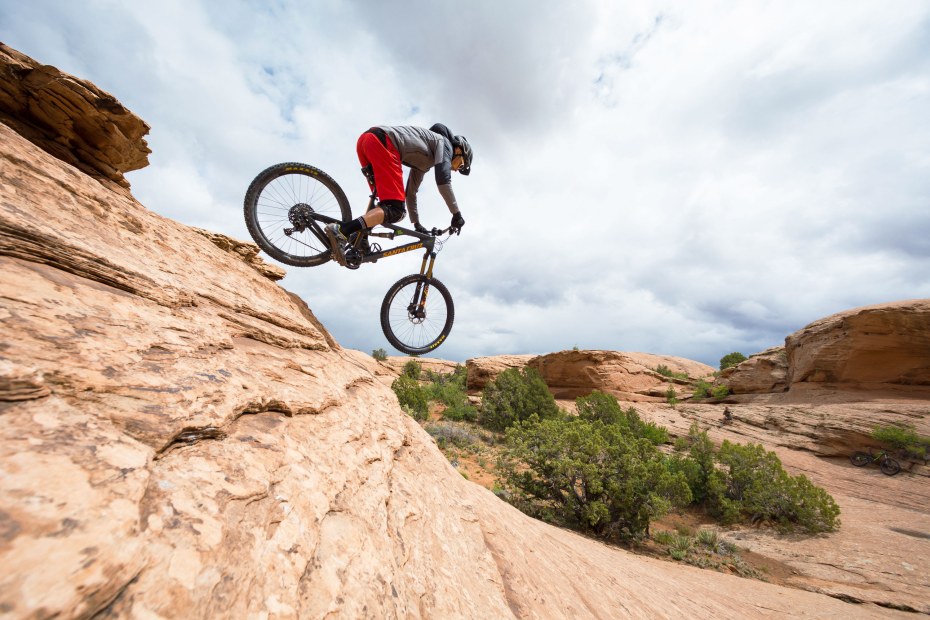 A mountain biker drops in on the Slickrock trail in Moab, Utah.