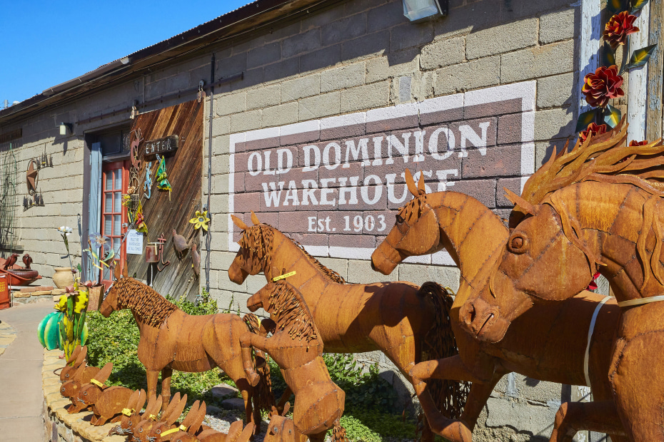 Metal sculptures of horses line the walk into Pickle Barrel Trading Post in Globe.