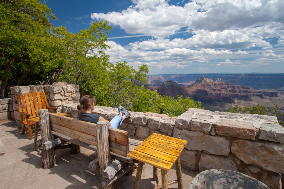 A woman sits on the terrace of the Grand Canyon Lodge on the North Rim of Grand Canyon National Park.