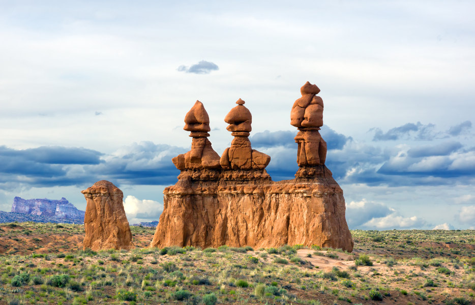 Hoodoos in Utah's Goblin Valley State Park on a partly cloudy day.