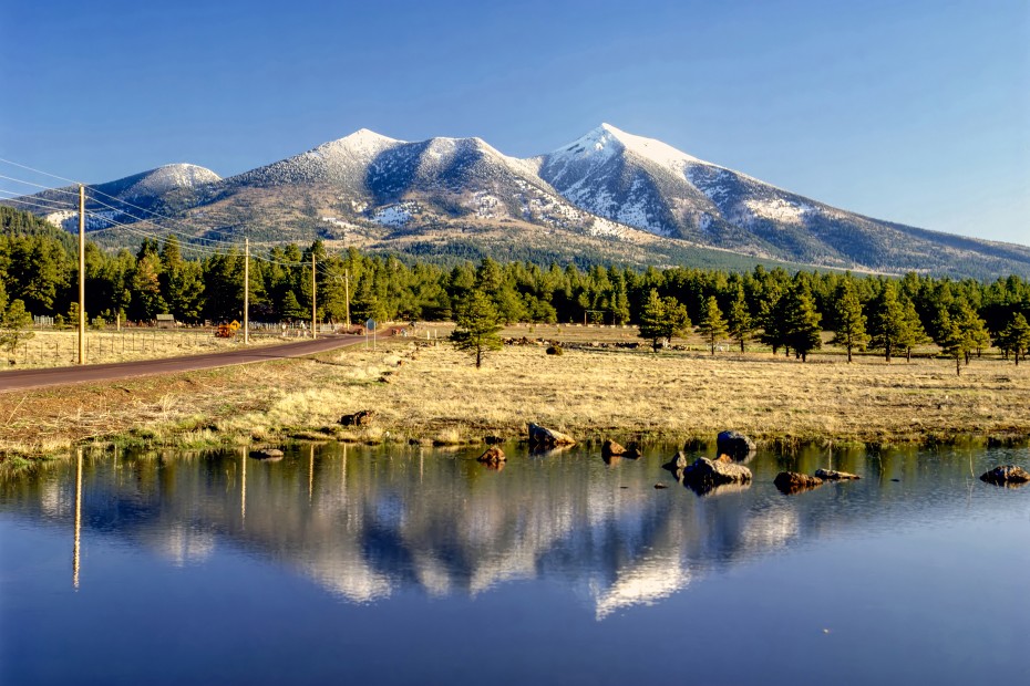 Snow dusted San Francisco Peak is reflected in a pond in Flagstaff, Arizona