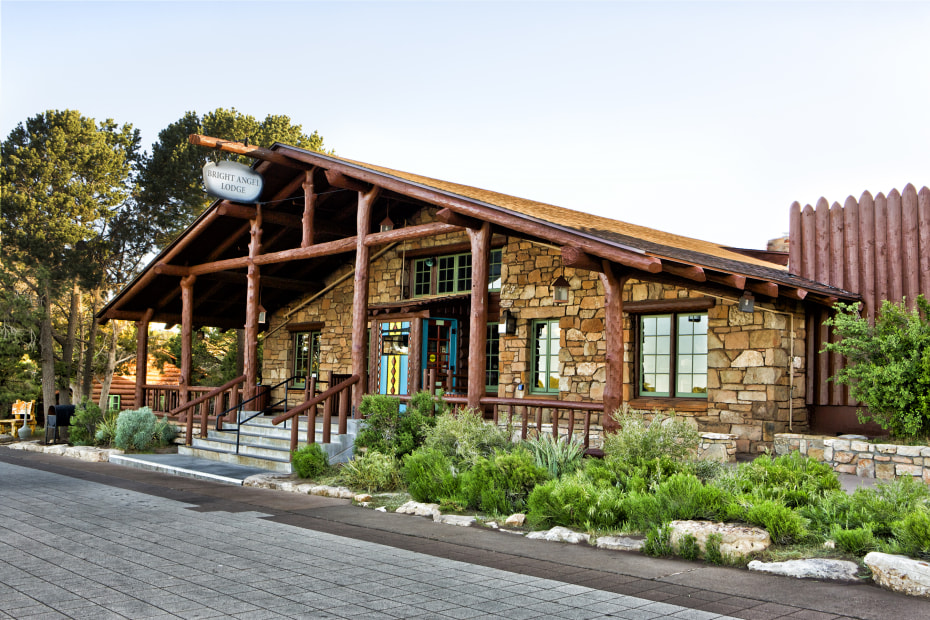 The rustic timber-and-stone facade of the Bright Angel Lodge near Grand Canyon National Park. 