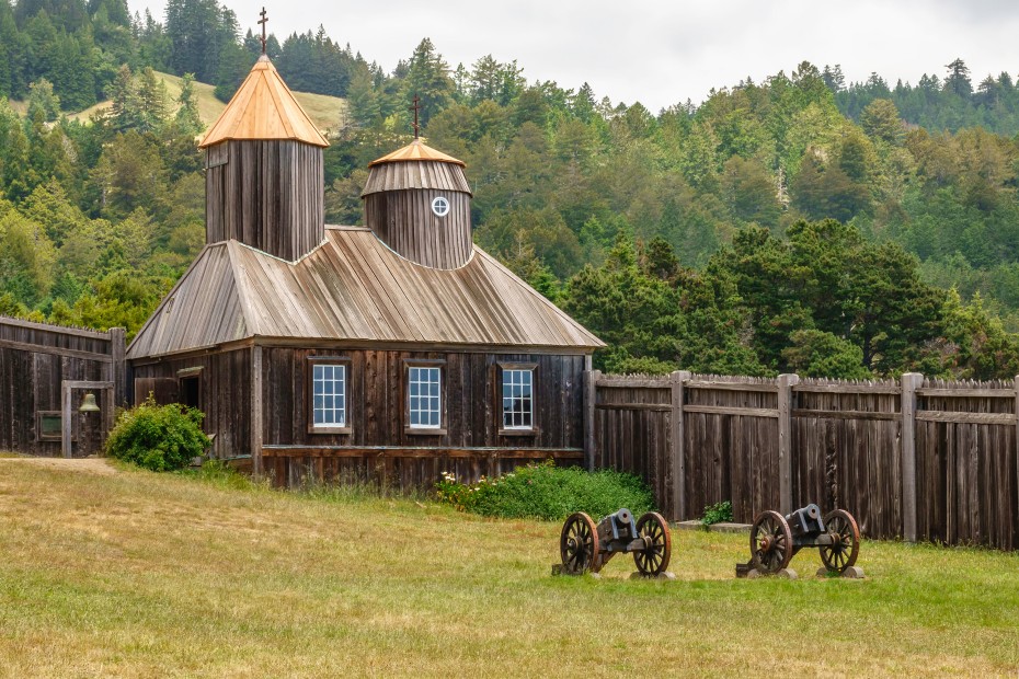 Two antique cannons in front of the restored Russian Orthodox chapel (originally built around 1825) at Fort Ross State Historic Park in Jenner, California.
