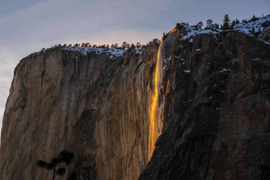 Yosemite National Park's Horsetail Fall glows orange in the setting sun to create its famous Firefall effect.