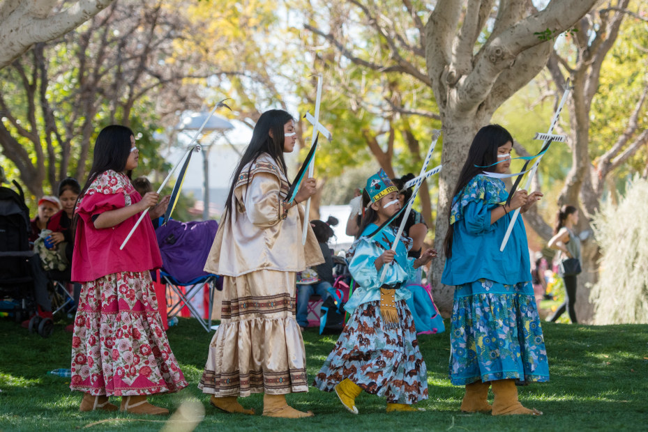 Four girls walk in the Parada del Sol and Arizona Indian Festival in Scottsdale, Arizona.