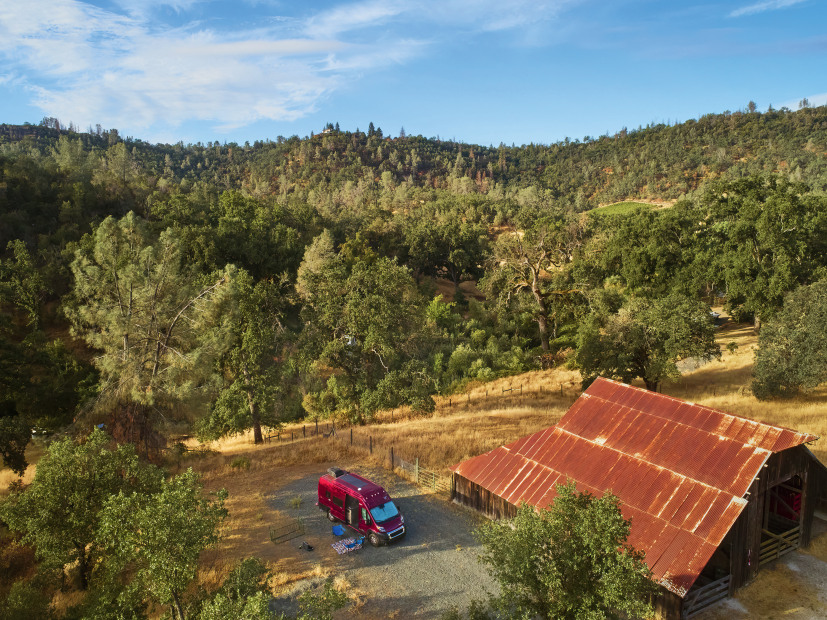 A red van parked in one of the RV spots at Six Sigma Ranch Vineyard and Winery in Lower Lake, California.