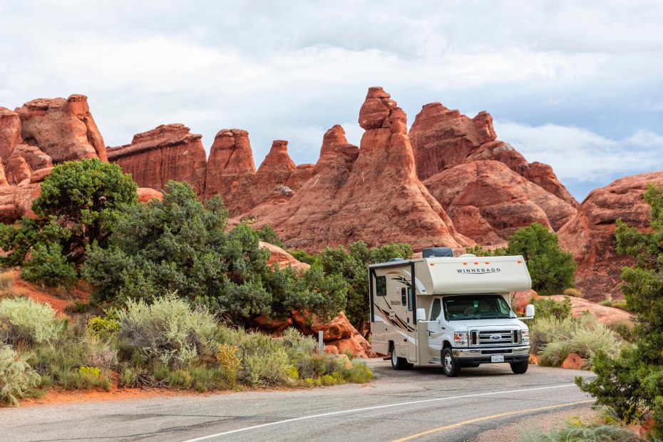 An RV parked at a campsite in Devils Garden Campground in Arches National Park, Utah on a cloudy day.
