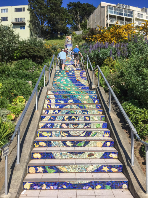 Tourists climb the moasic stairs at 16th and Moraga in San Francisco's Golden Gate Heights neighborhood.