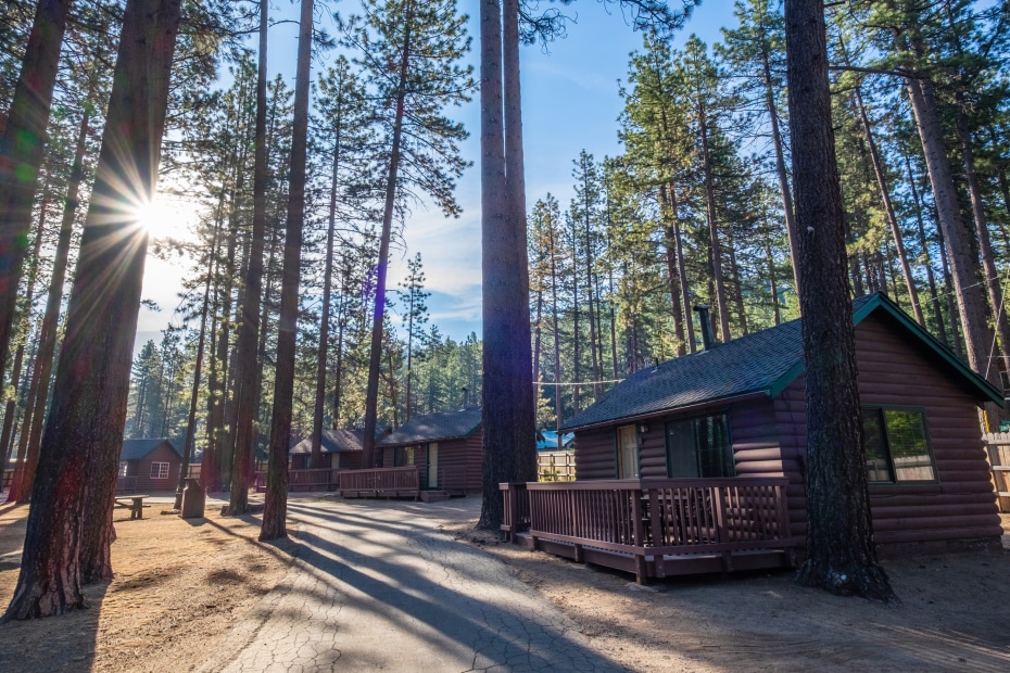Cabins stand under tall trees at Camp Richardson Resort near California's Lake Tahoe.