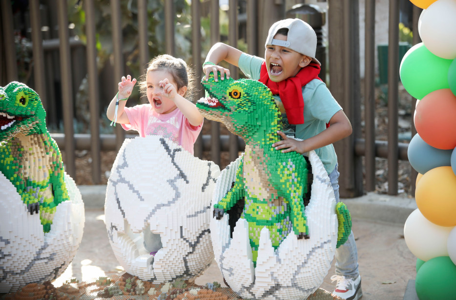 Kids play with the LEGO Dinosaur models inside Dino Valley at LEGOLAND California Resort.