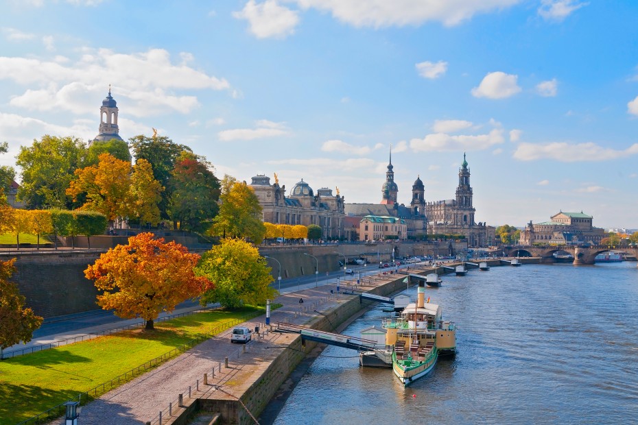 A boat docked along the Elbe river in Dresden, Germany in fall.