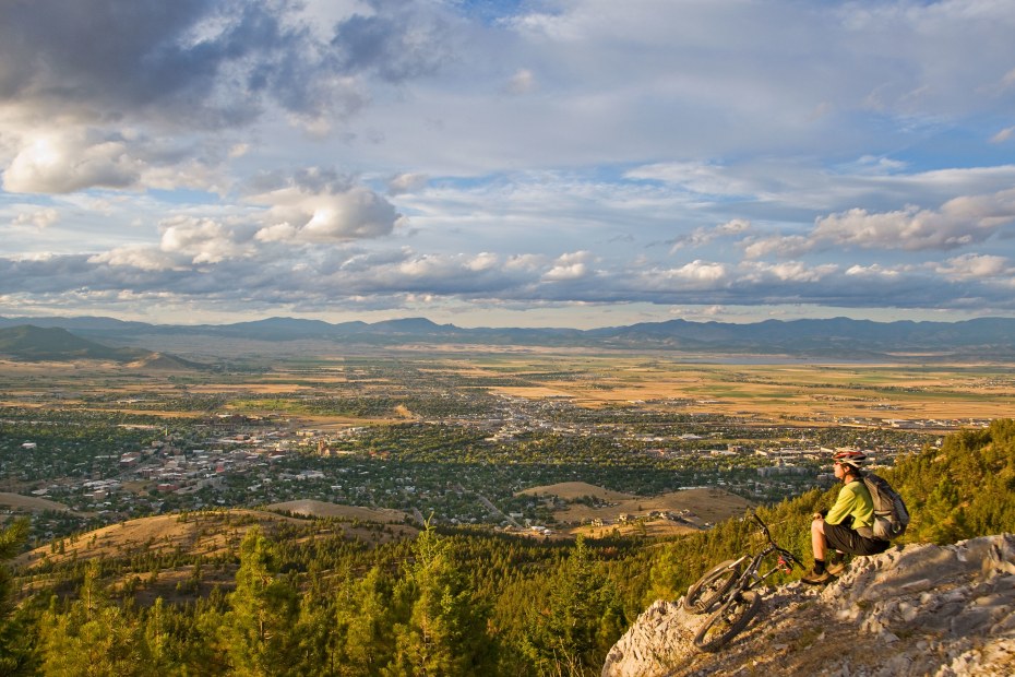 A mountain biker rests on a trail on the South Hills area of Helena, Montana.