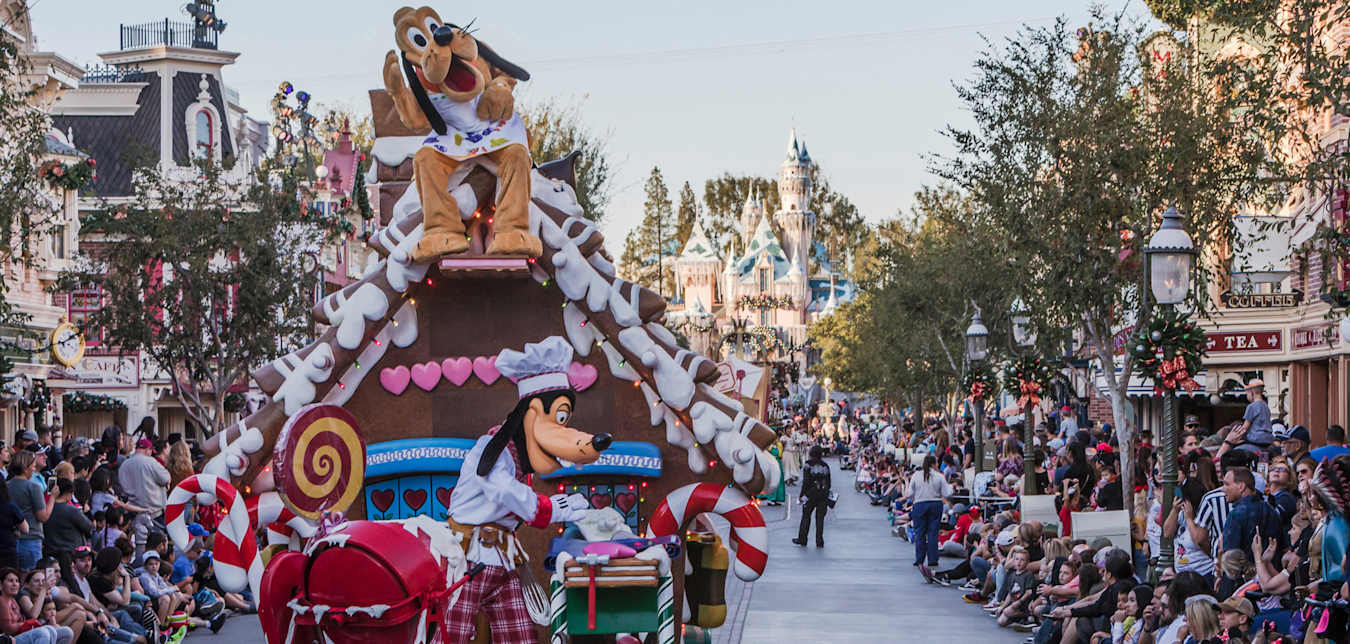 Goofy on a gingerbread house float during the daily Christmas parade at Disneyland