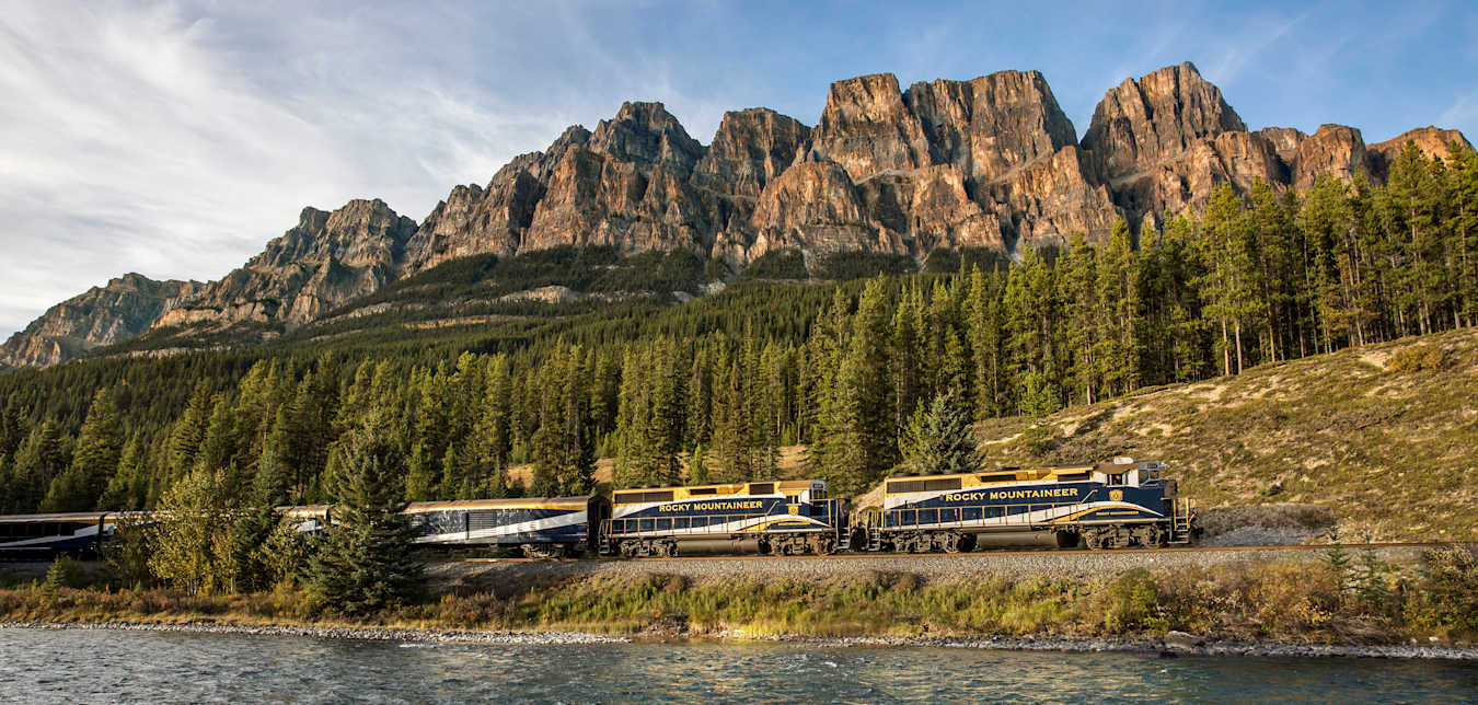 The Rocky Mountaineer rolls past Castle Mountain in Alberta, Canada, photo