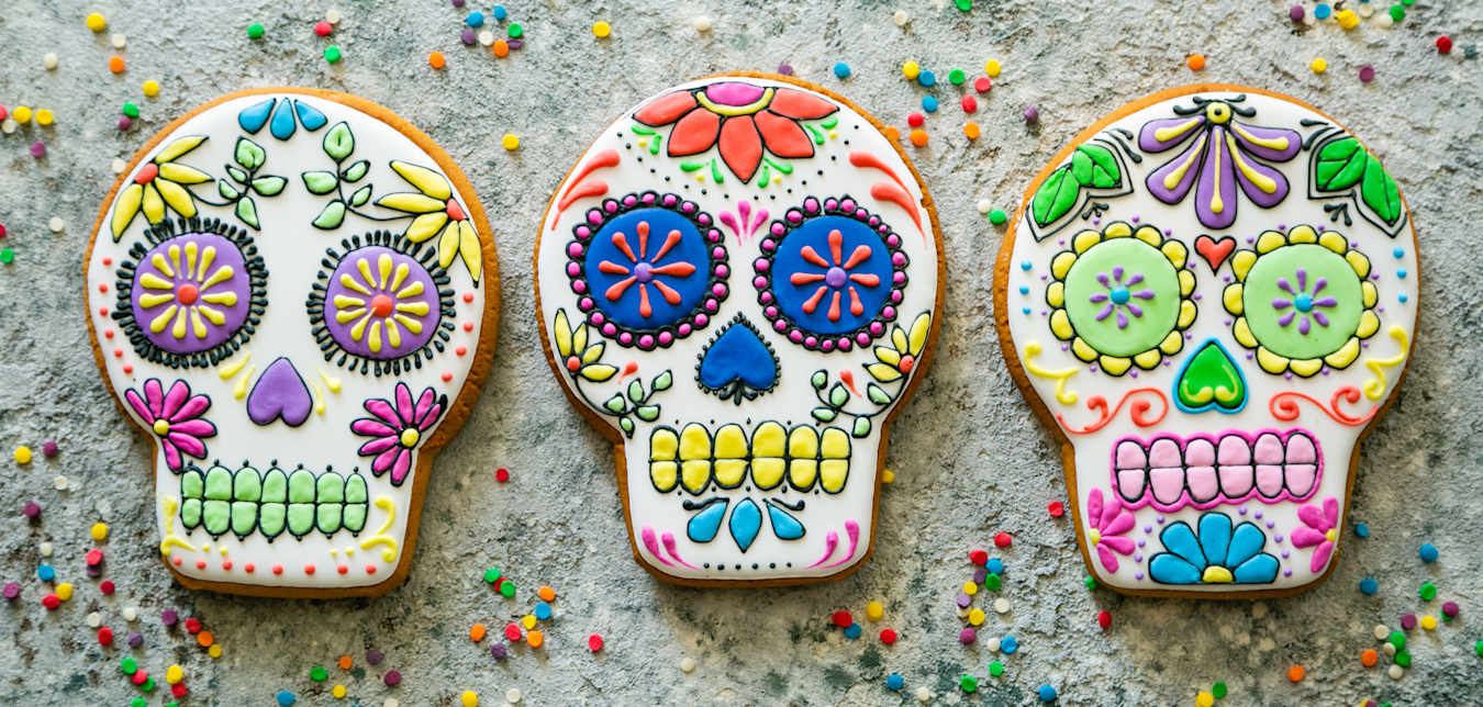 Cookies decorated like sugar skulls for Day of the Dead.