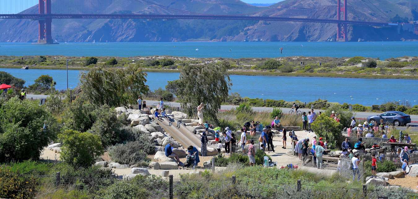 Families play at the Presidio Tunnel Tops in San Francisco, California.