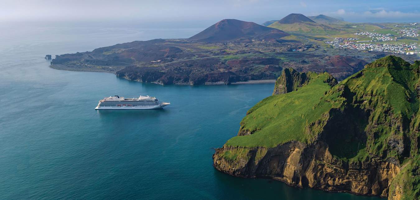 A Viking ocean cruise ship heads to port in Iceland.