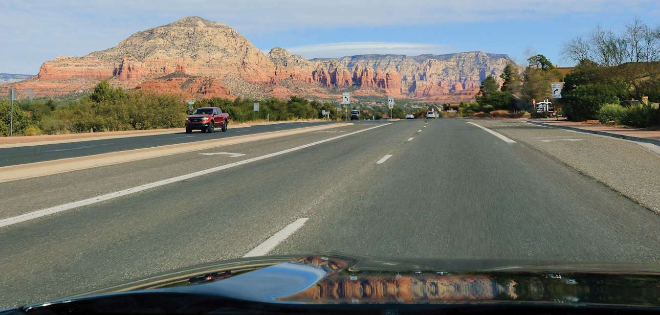 The driver's point of view from a vehicle on an Arizona highway. 