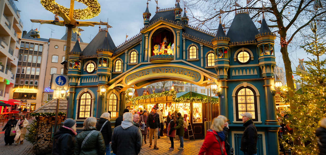 The exterior of a brightly lit Christmas market in Germany