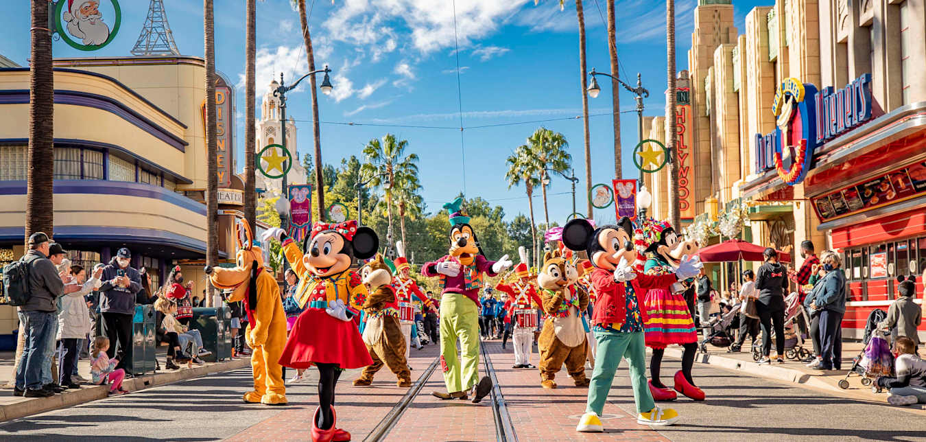 Mickey, Minnie, and Goofy dance in “Mickey’s Happy Holidays” during Disney Festival of Holidays at Disney California Adventure Park in Anaheim, California.