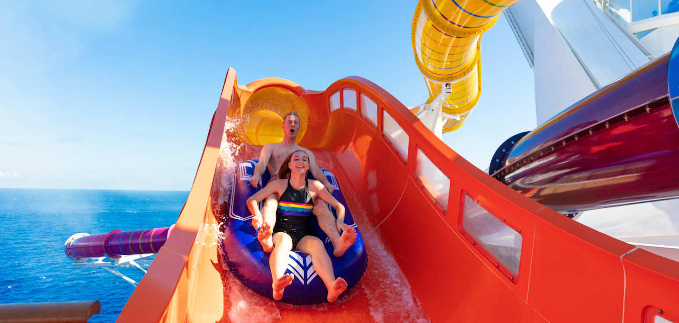 Father and daughter ride the Blaster on Royal Caribbean's Navigator of the Seas cruise ship.