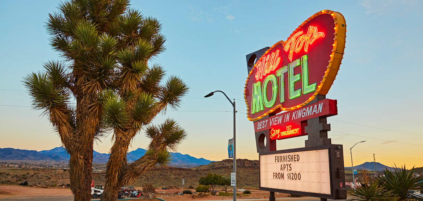Hill Tops Motel neon sign at dusk in Kingman, Arizona, on Route 66.