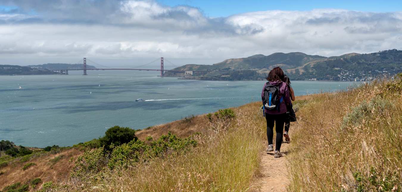Two hikers on the trail to Mt. Livermore on Angel Island in the San Francisco Bay.