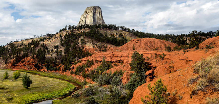 rock monolith looms over Devils Tower National Monument in Wyoming