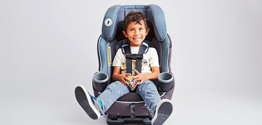 child seated in a blue car seat