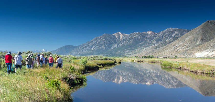 Group of people walking along a trail at the Nature Conservancy’s River Fork Ranch preserve in Nevada, photo