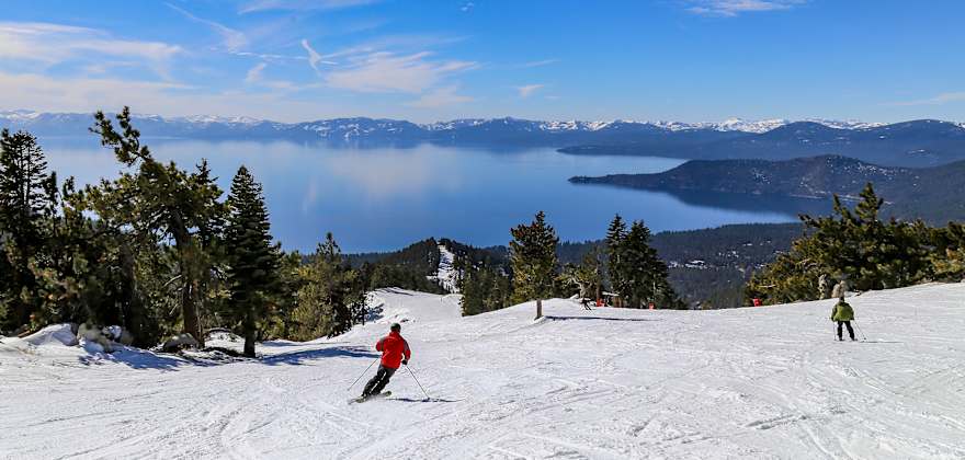 AAA Members ski with views of Lake Tahoe.