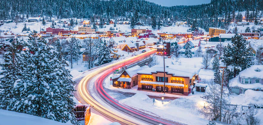 Aerial view of Truckee, California covered in snow at dusk.