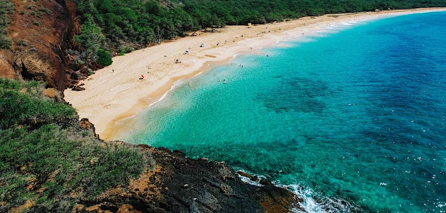 People lounge and play at Big Beach on Maui, Hawaii.