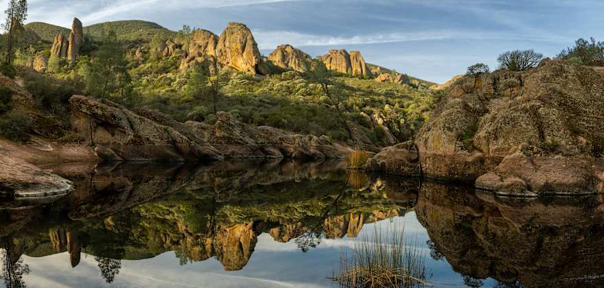 Bear Gulch Reservoir in Pinnacles National Park on a party cloudy day.