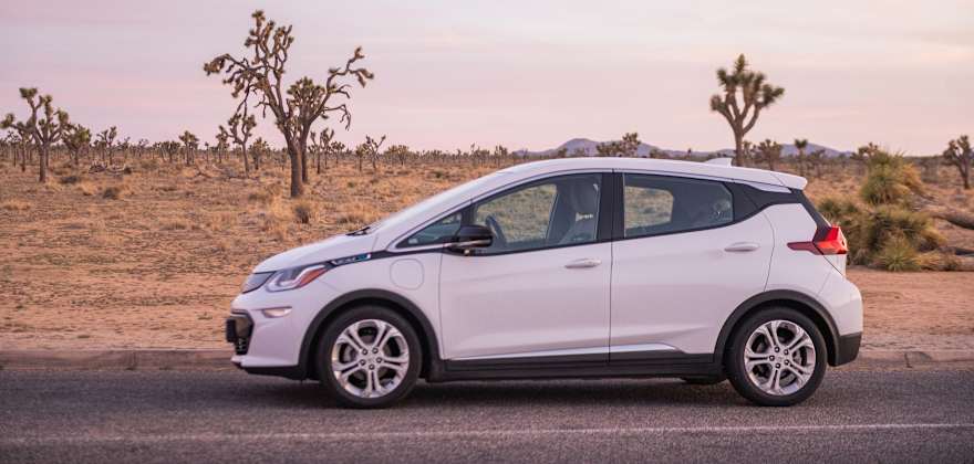 A Chevy Bolt EV on a desert road in Joshua Tree National Park.