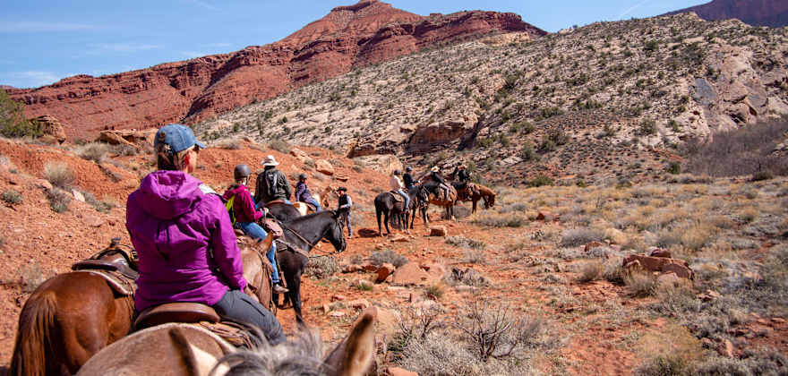 Tourists enjoy a trail ride with staff from Red Cliffs Lodge near Moab, Utah.