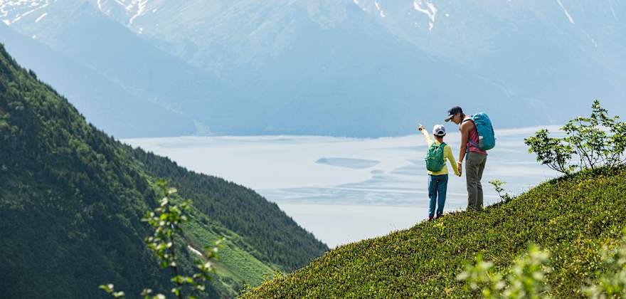 A parent and child take in an epic view in Alaska