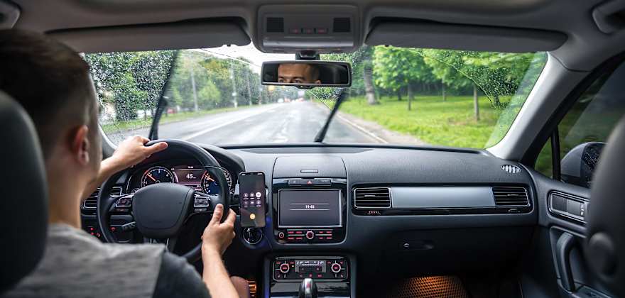 A driver practices road safety in the rain
