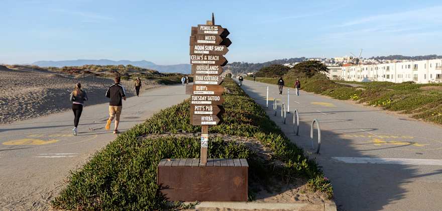 People enjoying the sunny day at Sunset Dunes park near Judah St. in the Outer Sunset District of San Francisco.
