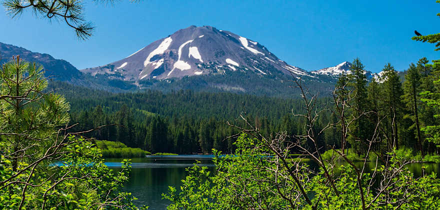 Lassen Peak reflects in Manzanita Lake in Lassen Volcanic National Park, California.