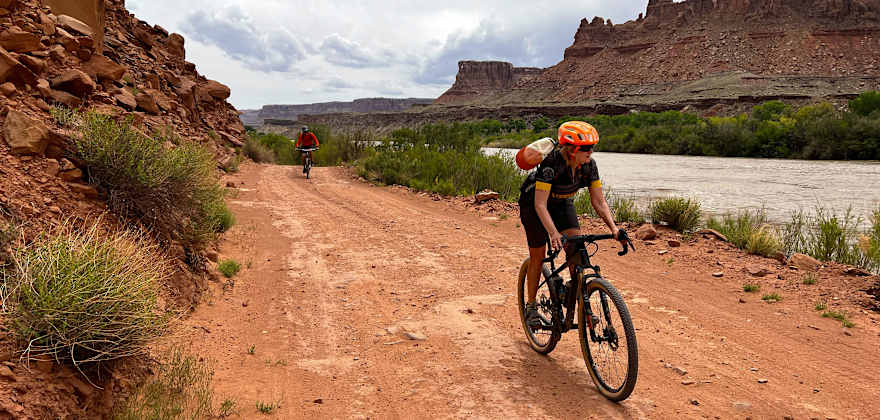 Two people ride gravel bikes on the White Rim trail near Moab, Utah.