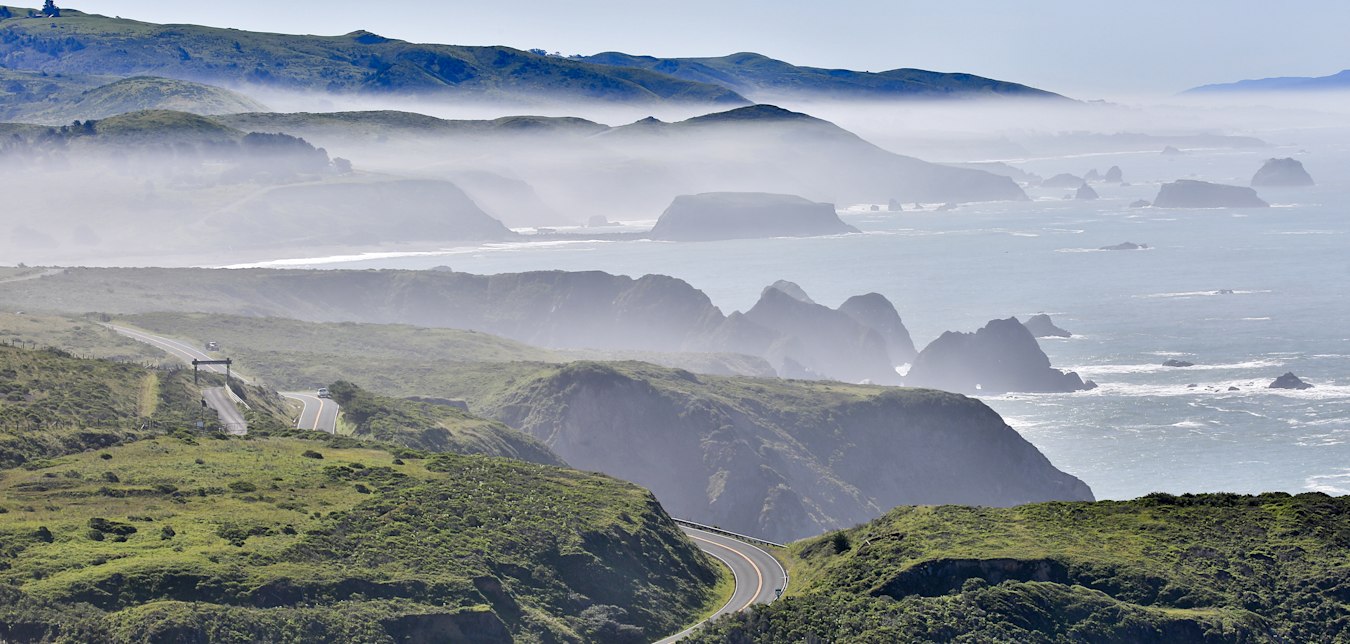 Fog comes over the coastal bluffs along California's Highway 1.