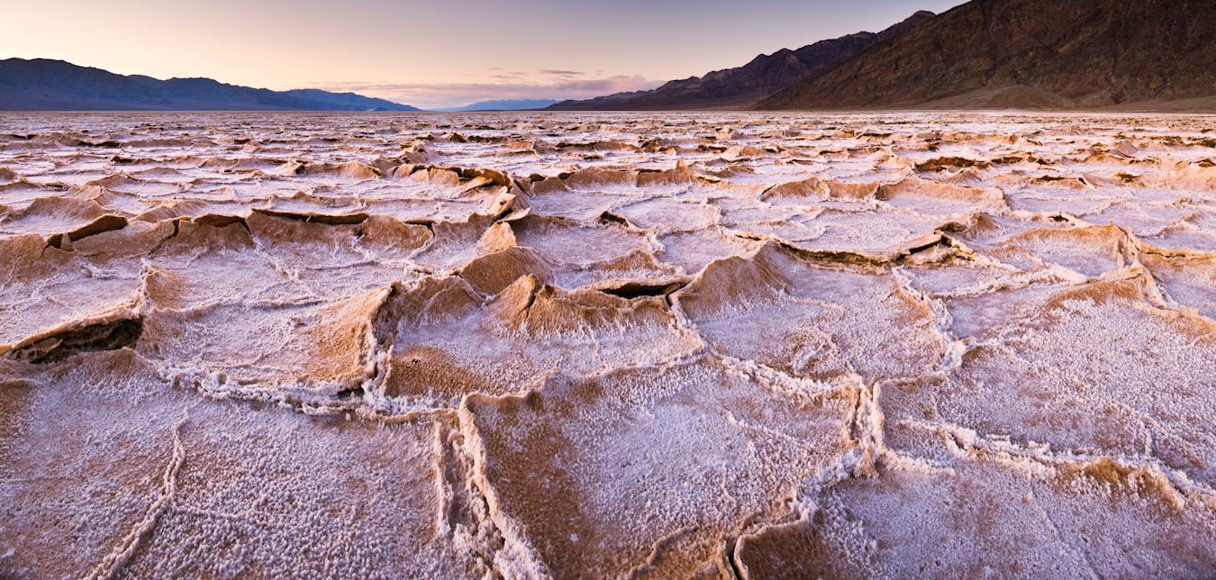Salt formations in Badwater Basin at dusk in Death Valley National Park, California.