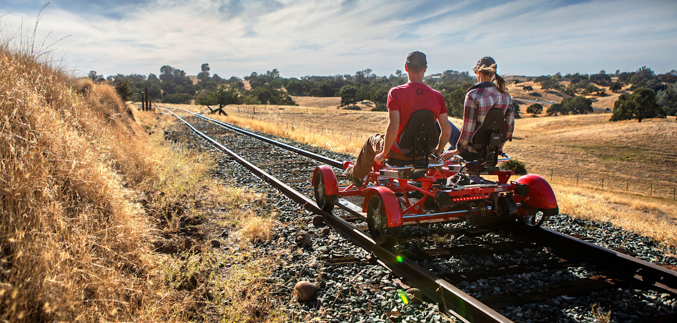 A couple pedal on old railroad tracks with Rail Explorers in Amador County.