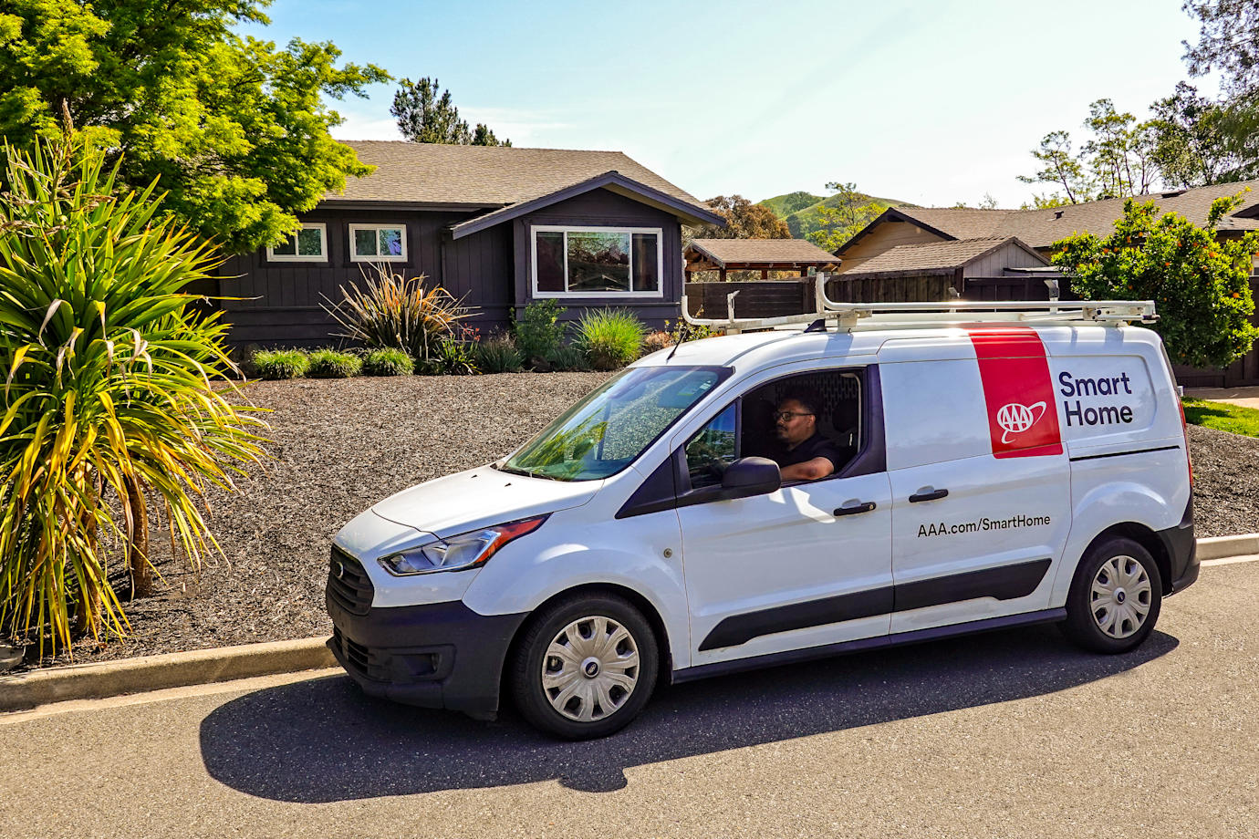 Smart Home Security van in front of a house
