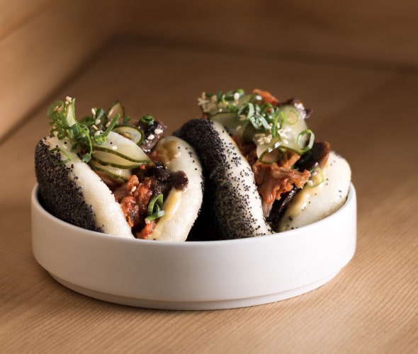 picture of the poppy seed covered steamed buns with beef tongue and kimchi at Liholiho Yacht Club